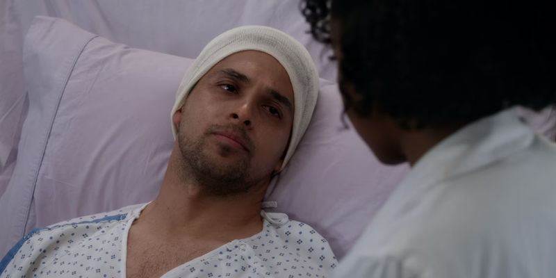 Wilmer Valderrama As Kyle Diaz Lying In Hospital Bed Looking At Stephanie In Grey's Anatomy.jpg