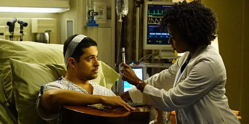 Kyle In Hospital Bed With Guitar While Stephanie Examines Him In Grey's Anatomy.jpg