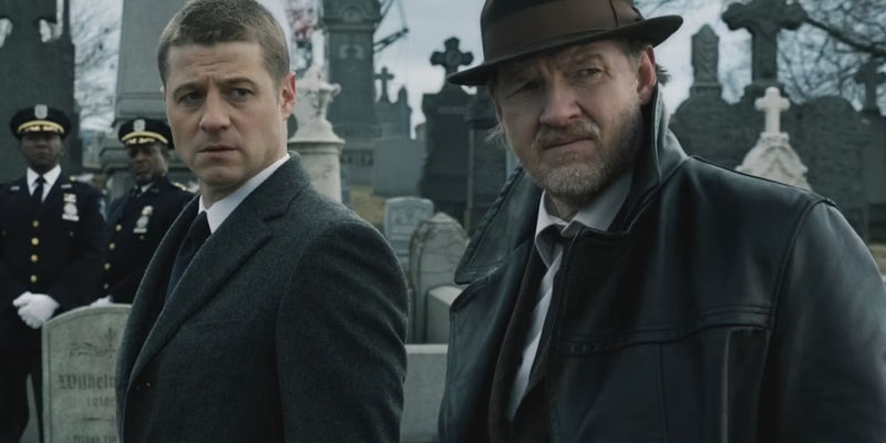 Young Harvey Bullock and Jim Gordon in a graveyard in Gotham 