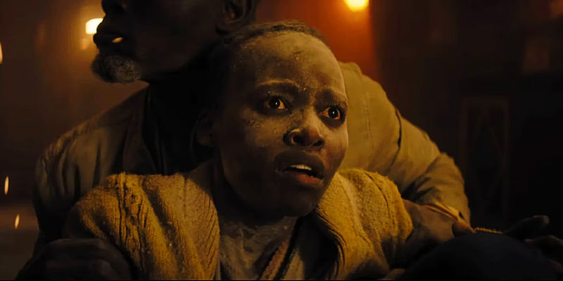 Lupita Nyongo looking terrified in A Quiet Place Day One