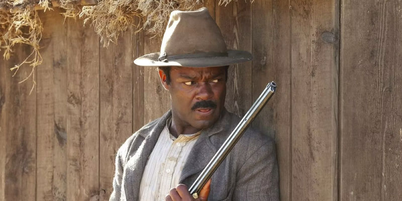 David Oyelowo as Bass Reeves holding a gun in Lawmen: Bass Reeves.