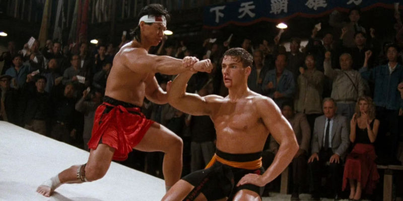 Frank Dux blocking a strike from Chong Li in bloodsport