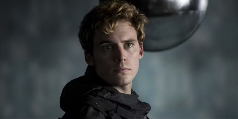 Finnick Odair looking at something in The Hunger Games Mockingjay Part One