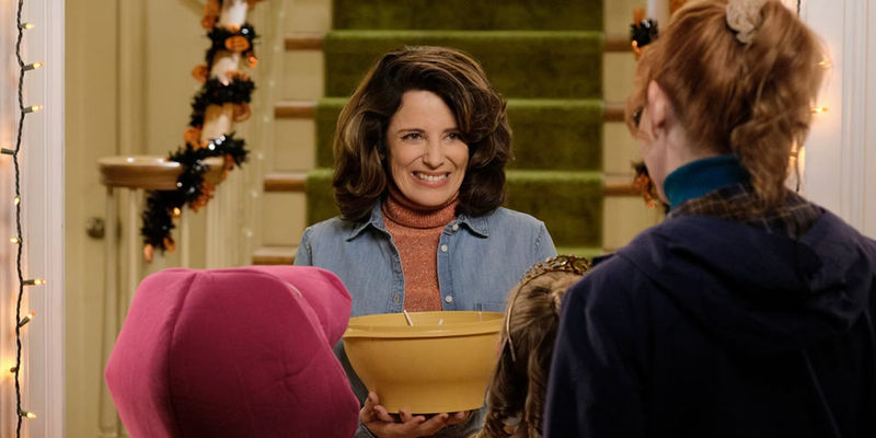 Susan gives out candy on Halloween night in Ted