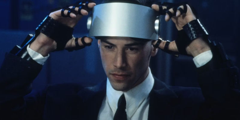 Johnny Mnemonic wears a silver visor in Johnny Mnemonic.