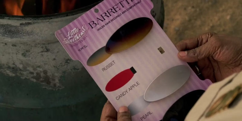 Deacon's barrette package with the red barrette missing in The Little Things.