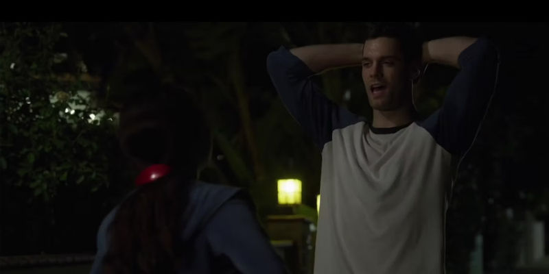 Ronda (Maya Kazan) with a red barrette in her hair in The Little Things speaking to a man..