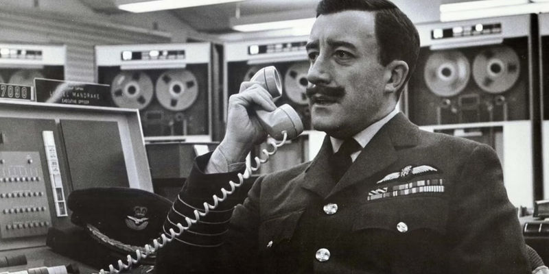 Peter Sellers as Lionel Mandrake speaking on the phone in Dr. Strangelove