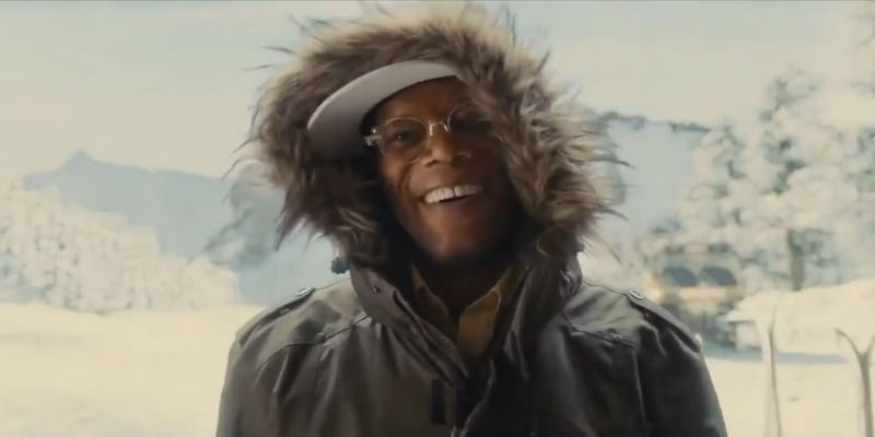 Richmond Valentine (Samuel L. Jackson) smiling in the snow in a parka in Kingsman The Secret Service.