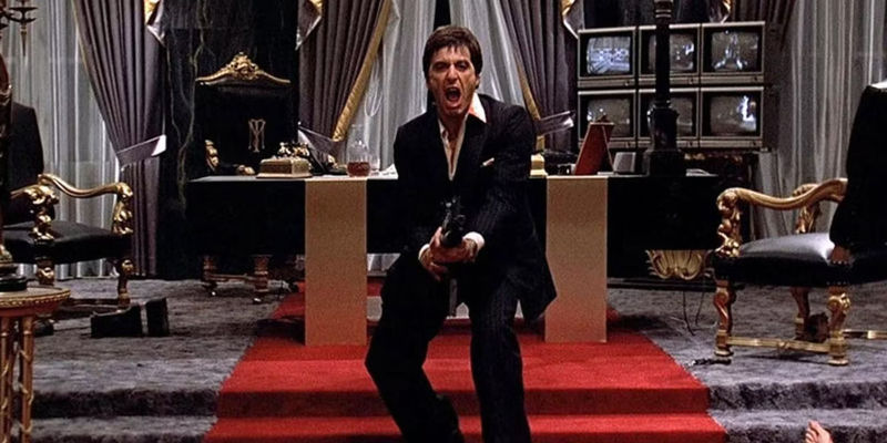Al Pacino as as angry Tony Montana preparing to launch a grenade from his custom rifle in Scarface.
