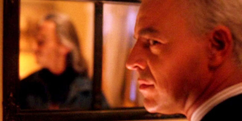 Leland Palmer (Ray Wise) looking over his shoulder in Twin Peaks, with his reflection in the mirror as Bob.