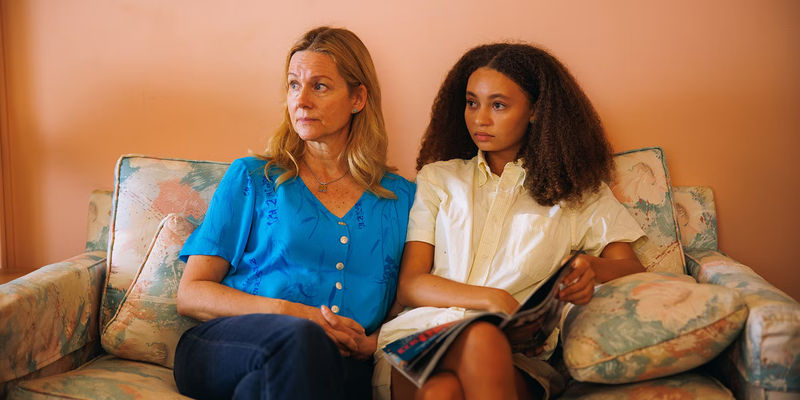 Doris (Nico Parker) and Kristine (Laura Linney) siting on a couch in Suncoast