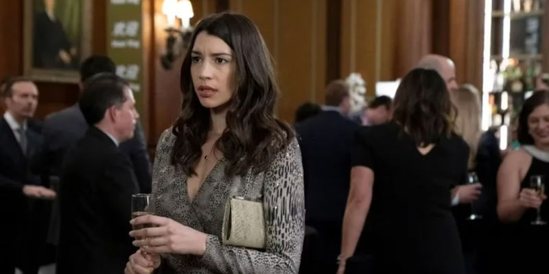 Kat (Jamie Gray Hyder) with a glass of champagne in Law & Order SVU