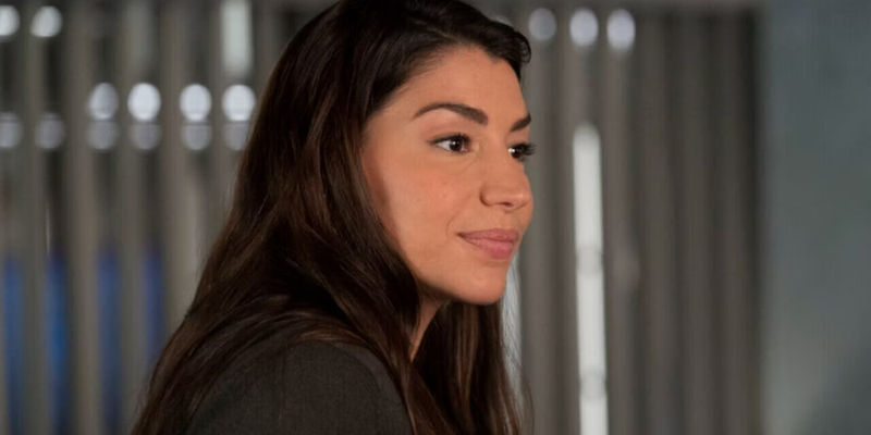 Kat (Jamie Gray Hyder) sitting in an office in Law & Order SVU