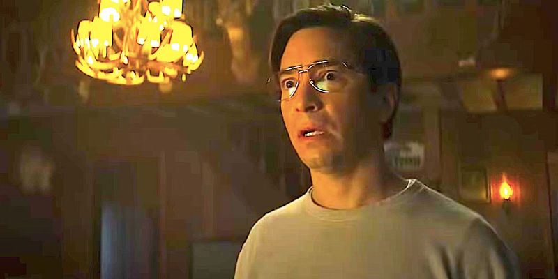 A terrified Mr. Bratt stares at something in Goosebumps 2023 season 1 with a chandelier in the background