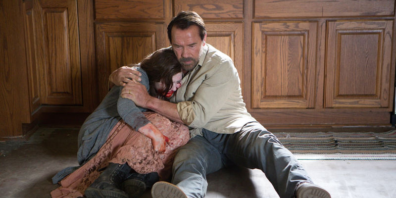 Arnold Schwarzenegger hugging Abigail Breslin in a still from Maggie