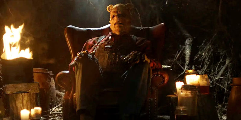Dark Winnie sitting on his couch in Winnie-the-Pooh Blood and Honey 2