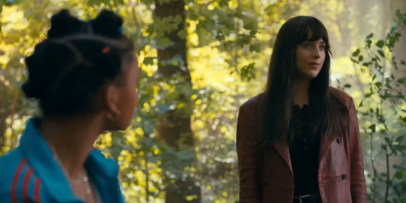 Mattie looks at Cassie in the woods in Madame Web