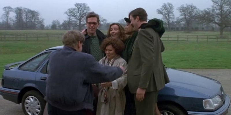 The friend group in Peter's Friends posing for a photo