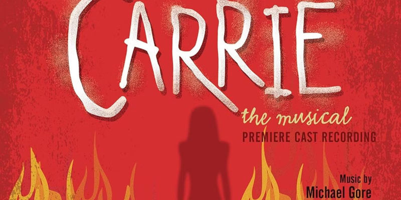 The poster for Carrie the Musical shows the shadow of Carrie standing in flames.