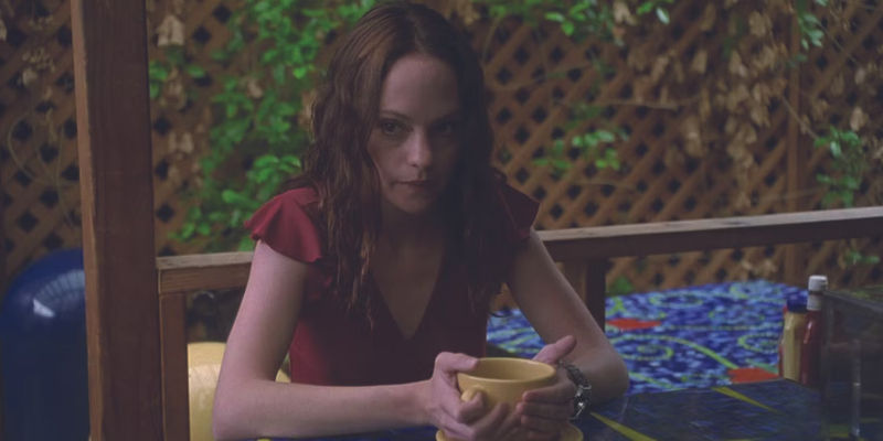 May drinks a cup of coffee alone in May