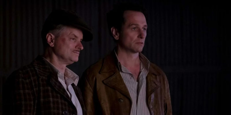 Perry Mason (Matthew Rhys) and Pete (Shea Whigham) looking concerned in Perry Mason.