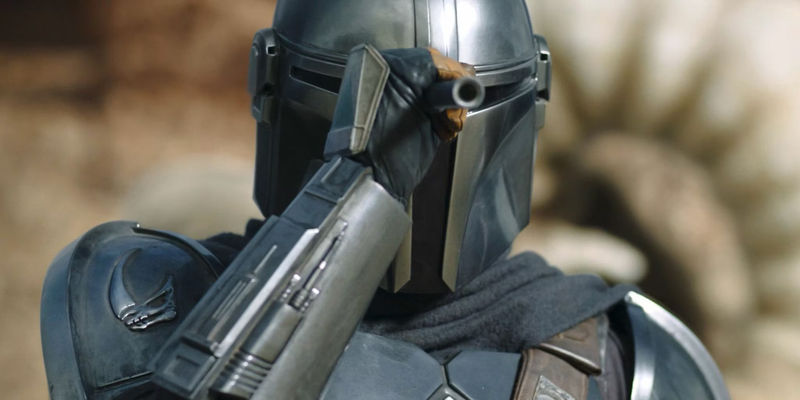 Din Djarin uses his scope to watch the krayt dragon on Tatooine in The Mandalorian season 2 episode 1