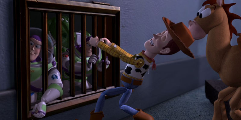 Wood in Toy Story 2 trying to open a ventilation cover with 2 Buzz Lightyears behind it as Bullseye watches