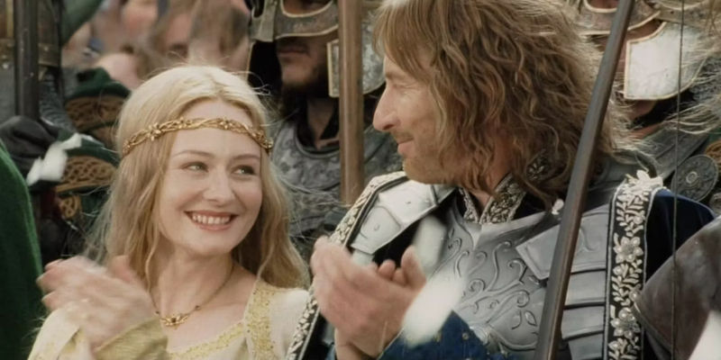 Eowyn and Faramir clapping and looking at each other during the Lord of the Rings: Return of the King Coronation