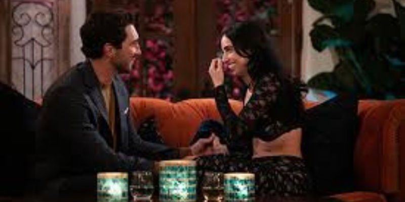 The bachelor season 28 joey and maria smiling with each other on a couch