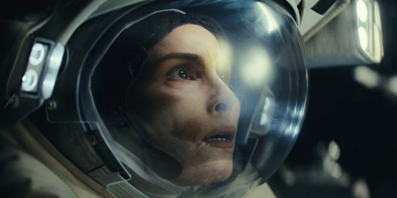 Noomi Rapace as Jo looking concerned in space in Constellation