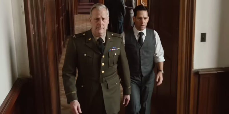 Jeff Daniels as Bill Donovan and Paul Rudd as Moe Berg walking through the OSS in The Catcher Was A Spy.