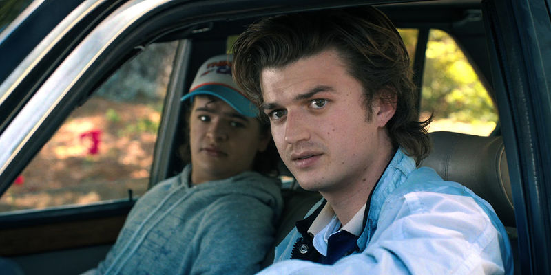 StrangerThings Season 4 part 1 Joe Keery as Steve Harrington in the car with Gaten Matarazzo as Dustin Henderson