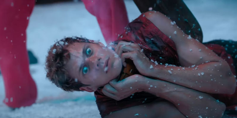 Bill Skarsgård getting dragged by the neck in Boy Kills World