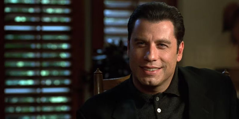 Chili Palmer (John Travolta) smiling in Get Shorty - Broadway Debut: Over Here!
