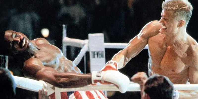 Ivan Drago punching Apollo Creed in Rocky IV - Rocky's Unspoken Guilt