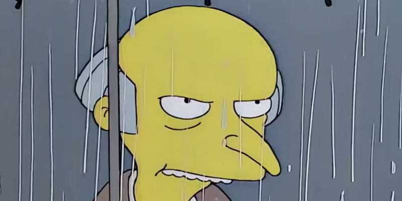Mr. Burns glares at Grampa Simpson in the rain from The Simpsons - The Enigmatic Villain: Unveiling Mr. Burns' True Nature