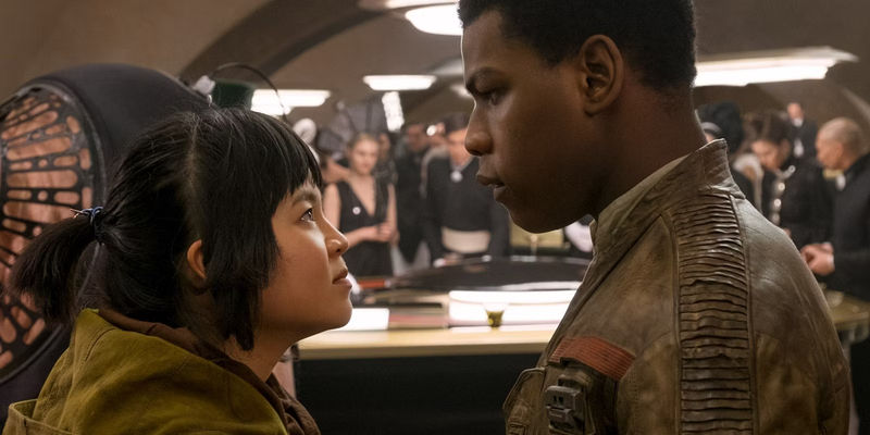 Rose and Finn looking at each other with people in the background in The Last Jedi - Star Wars: The Last Jedi - What Happened To Rose's Feelings For Finn?