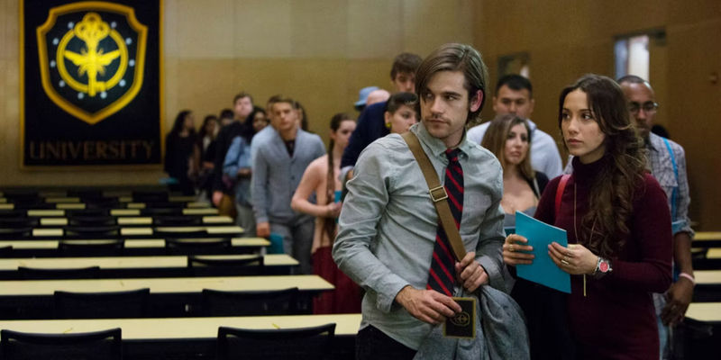 Stella Maeve as Julia and Jason Ralph as Quentin Standing at University in The Magicians