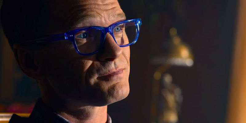 The Analyst wearing blue glasses in The Matrix Resurrections