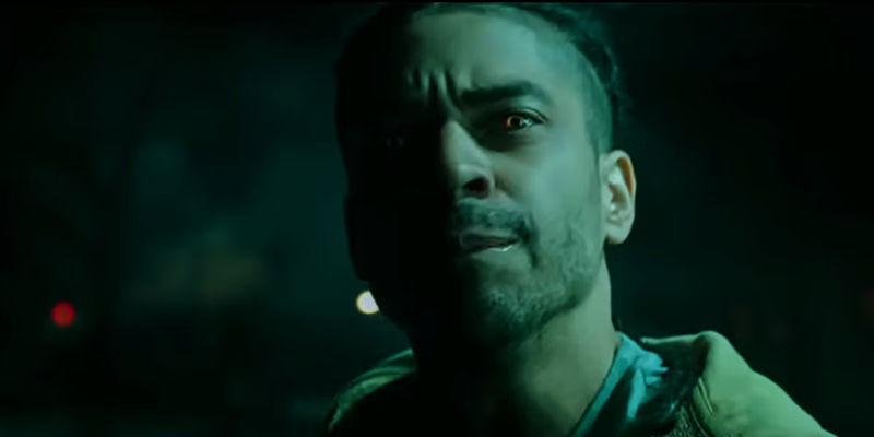 A looter looks upset while wearing red eye contacts in The First Purge.