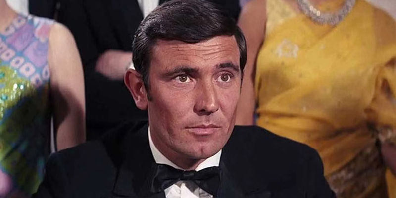 George Lazenby as James Bond wearing a tuxedo in On Her Majesty's Secret Service