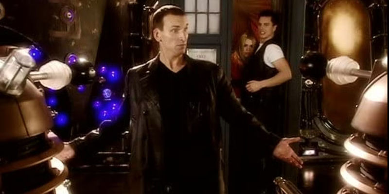 Christopher Eccleston as Ninth Doctor looking cocky and confronting the Daleks in Doctor Who