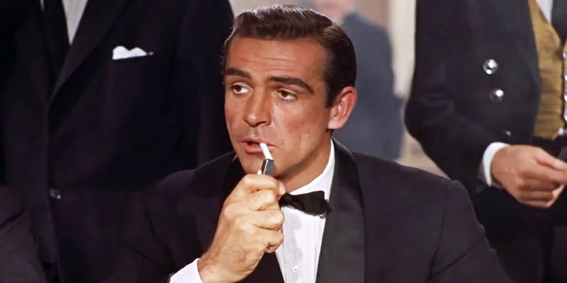 Sean Connery as James Bond lighting a cigarette in Dr. No