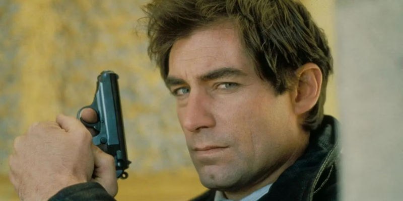 Timothy Dalton as James Bond with a Gun in The Living Daylights