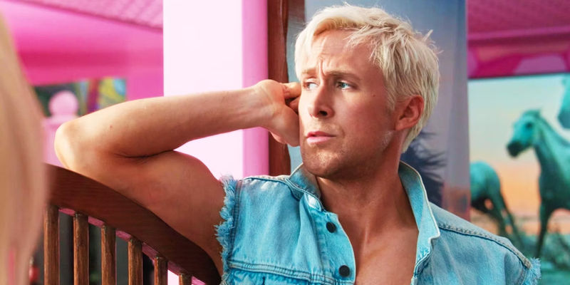 Ryan Gosling as Ken looking away from Barbie.