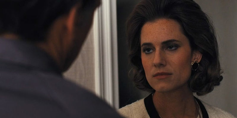 Lucy looking at Hawk in Fellow Travelers finale