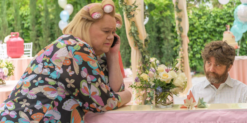 Louie Anderson as Christine Baskets talking on the phone and Zach Galfianakis as Chip looking at her in Baskets.