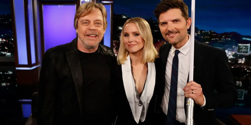 Mark Hamill, Kristen Bell, and Adam Scott holding a lighsaber on Jimmy Kimmel Live