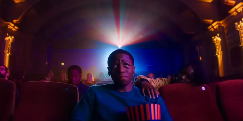 Dom and Yas talk on a bench in Rye Lane